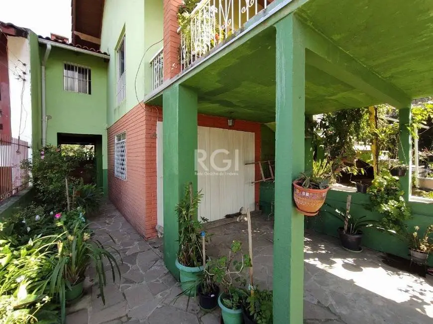 Foto 2 de Casa com 2 Quartos à venda, 139m² em Vila Nova, Porto Alegre