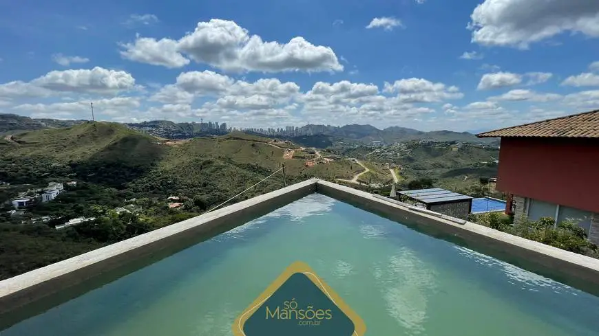 Foto 1 de Casa com 4 Quartos à venda, 577m² em Vila  Alpina, Nova Lima