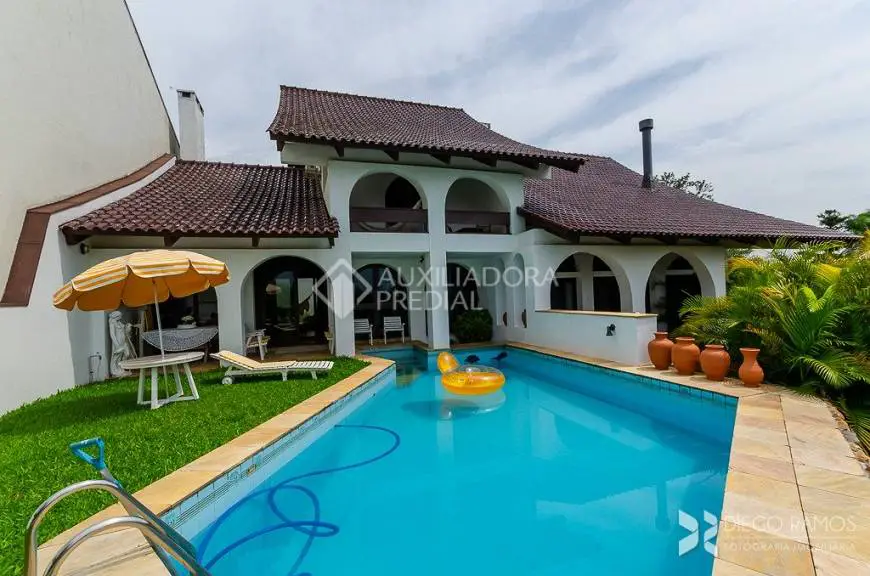 Foto 1 de Casa com 4 Quartos à venda, 456m² em Vila Assunção, Porto Alegre