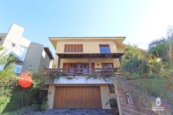 Foto 2 de Casa com 4 Quartos à venda, 389m² em Vila Nova, Porto Alegre