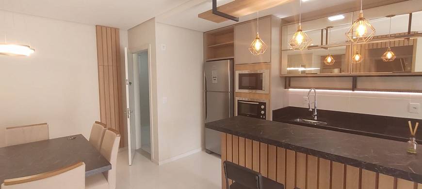 Foto 2 de Apartamento com 2 Quartos à venda, 76m² em Canasvieiras, Florianópolis