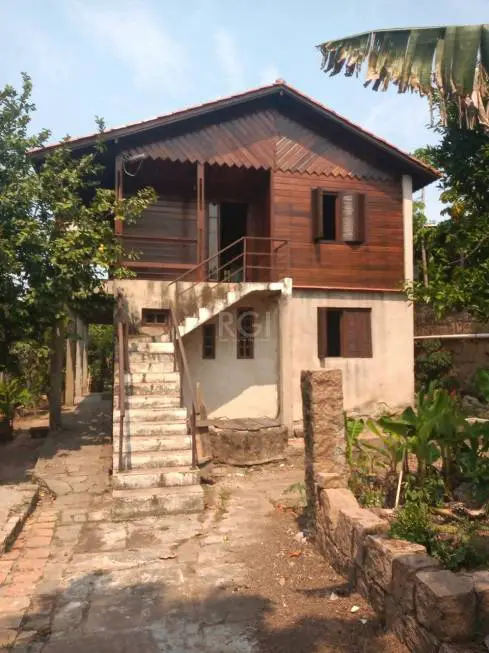 Foto 1 de Casa com 4 Quartos à venda, 190m² em Vila Nova, Porto Alegre