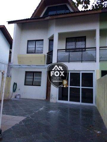 Foto 1 de Sobrado com 4 Quartos para alugar, 150m² em Xaxim, Curitiba