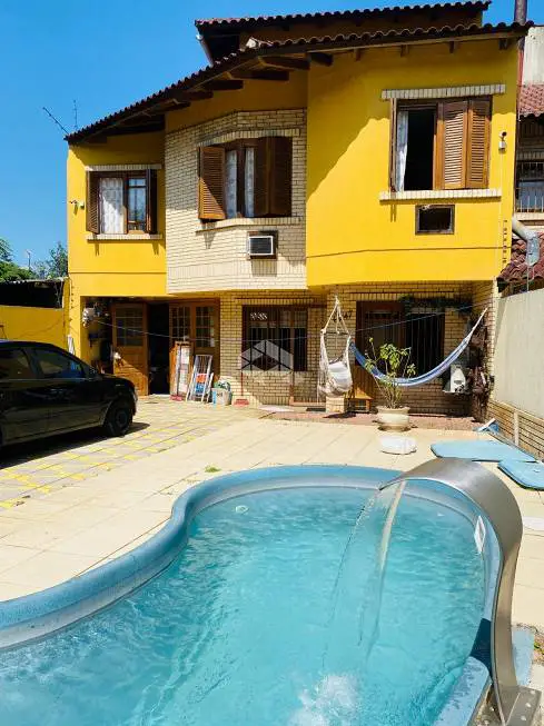 Foto 1 de Casa com 4 Quartos à venda, 112m² em Cavalhada, Porto Alegre