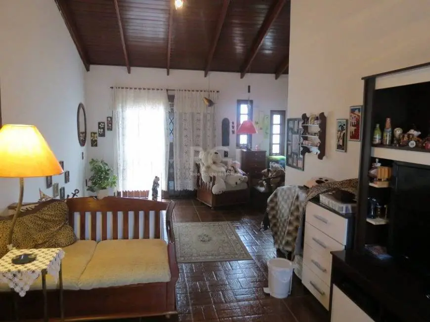 Foto 1 de Casa com 4 Quartos à venda, 136m² em Rio Branco, Porto Alegre