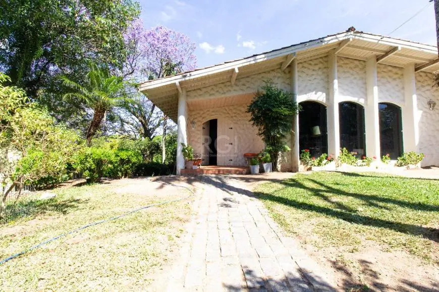 Foto 3 de Casa com 6 Quartos à venda, 422m² em Vila Assunção, Porto Alegre