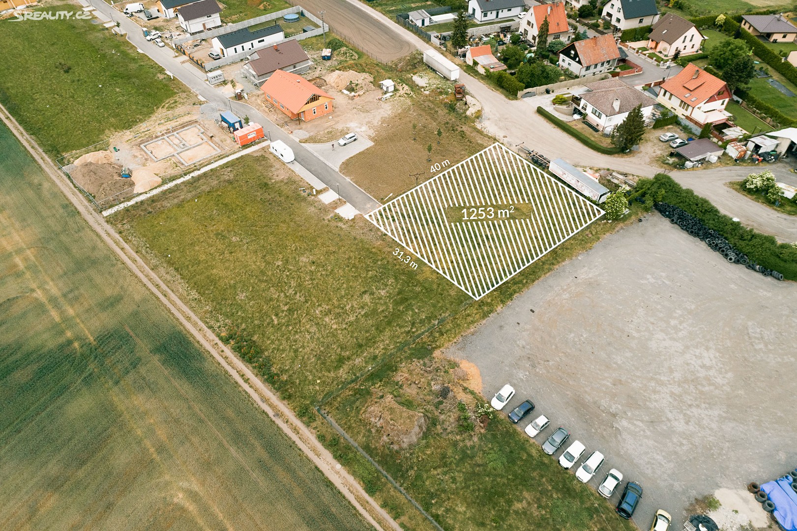 Prodej  stavebního pozemku 1 253 m², Nedomice, okres Mělník