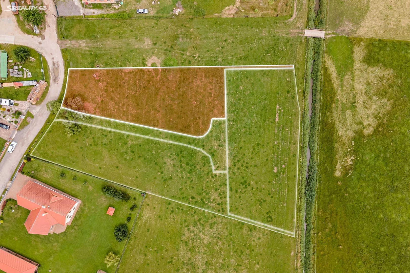 Prodej  stavebního pozemku 1 565 m², Tyršova, Lomnice nad Lužnicí