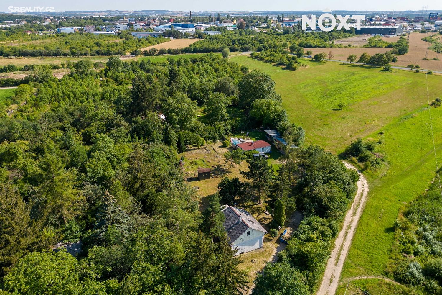 Prodej  stavebního pozemku 1 693 m², Praha 10 - Praha-Dubeč