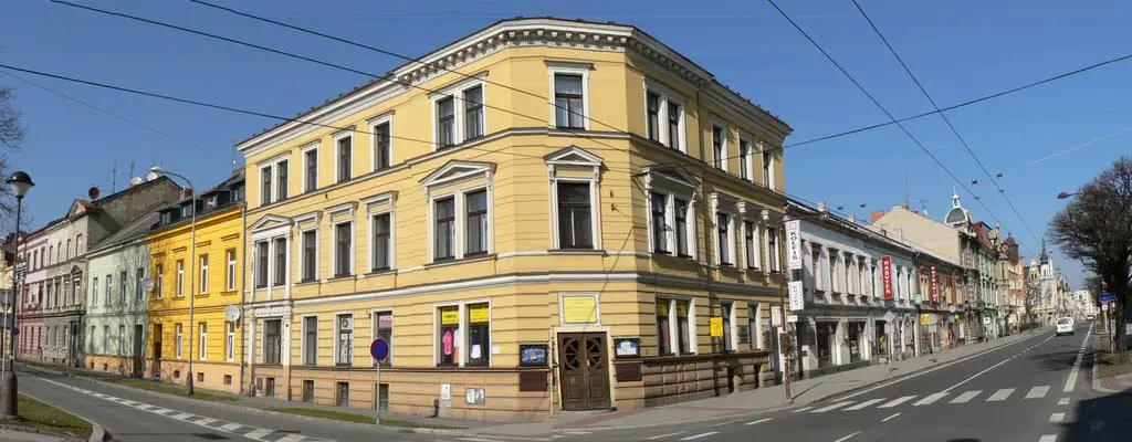At the corner of Olomouc and Hus (Master John) Street.